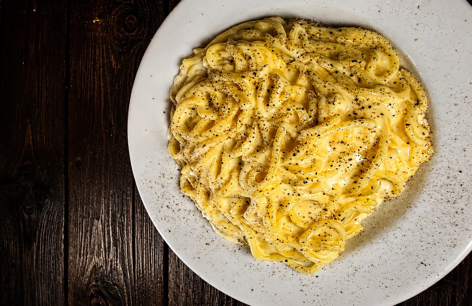Pasta with cheese sauce and pepper